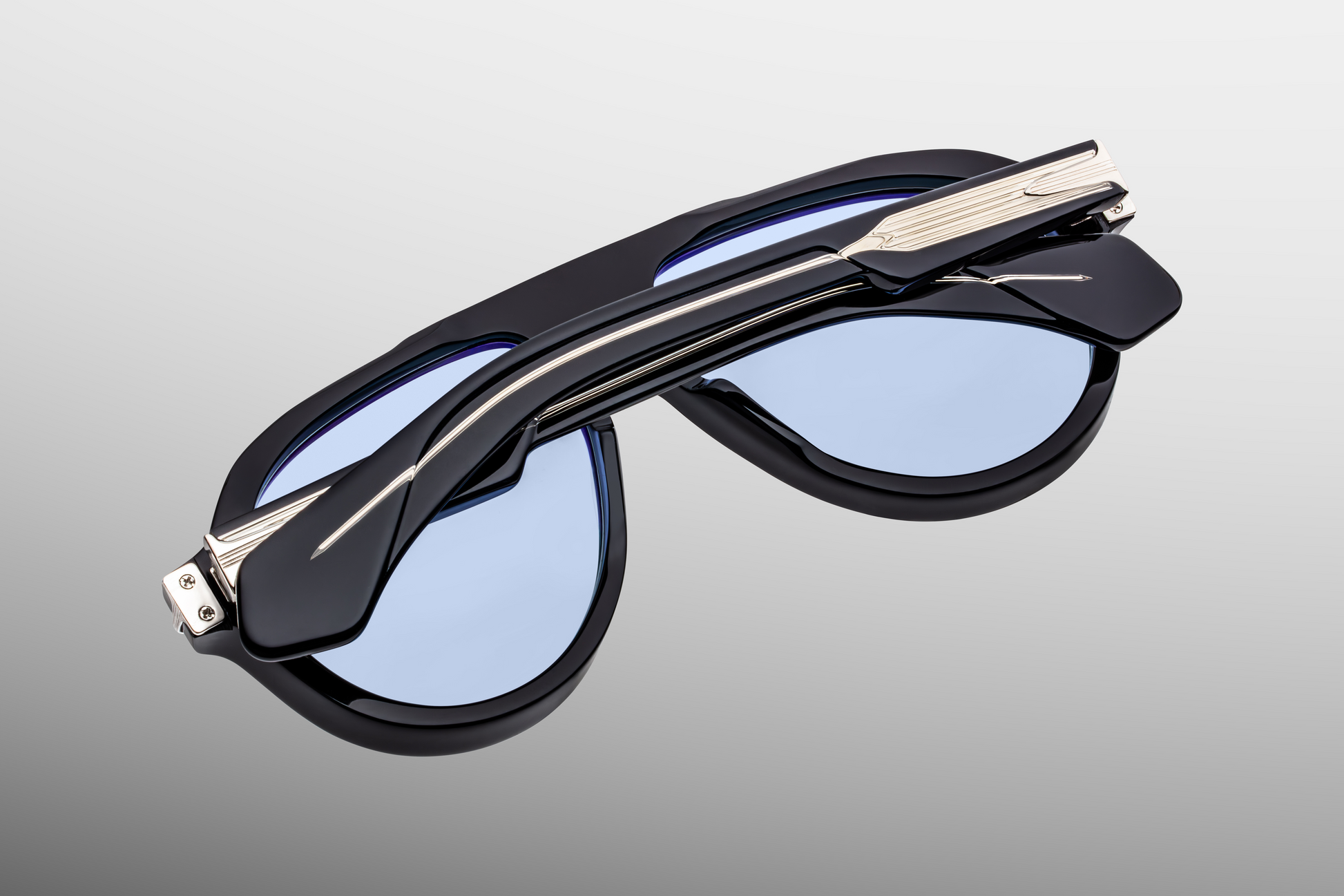 Temple detail of Jacques Marie Mage Donnybrooke Obscure sunglasses featuring signature arrowhead hardware and engraved core – available at WINK Optometrists.