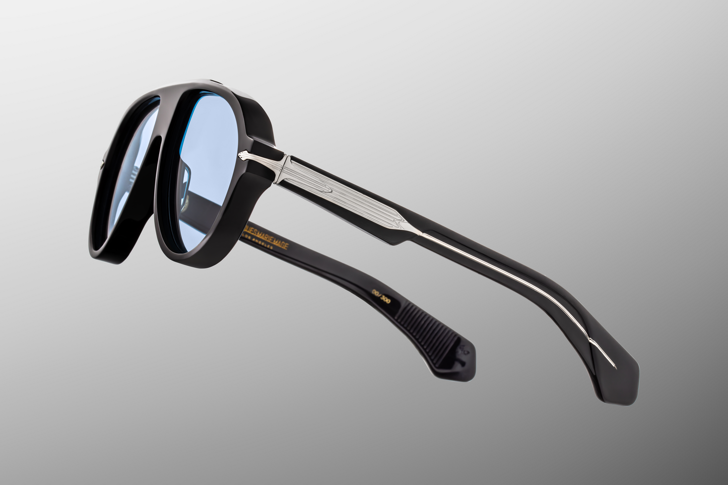 Side profile of Jacques Marie Mage Donnybrooke sunglasses in Obscure colourway with thick acetate temples and signature arrowhead rivets – available at WINK Optometrists.
