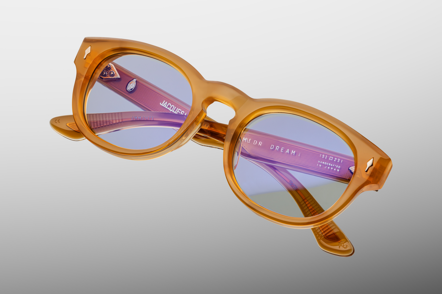 Top-down view of Dr. Dream Marigold — keyhole bridge, gently curved browline, and bevelled edges of the warm marigold acetate