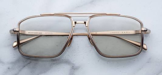 “Side view of Jacques Marie Mage Earl Altan sunglasses: handcrafted 100% titanium frame with silver eyerim inserts, dual-tone brow and temple details, Art Deco embellishments, and 4mm titanium lens-rim inserts. Limited edition of 500 pieces, handcrafted in Japan