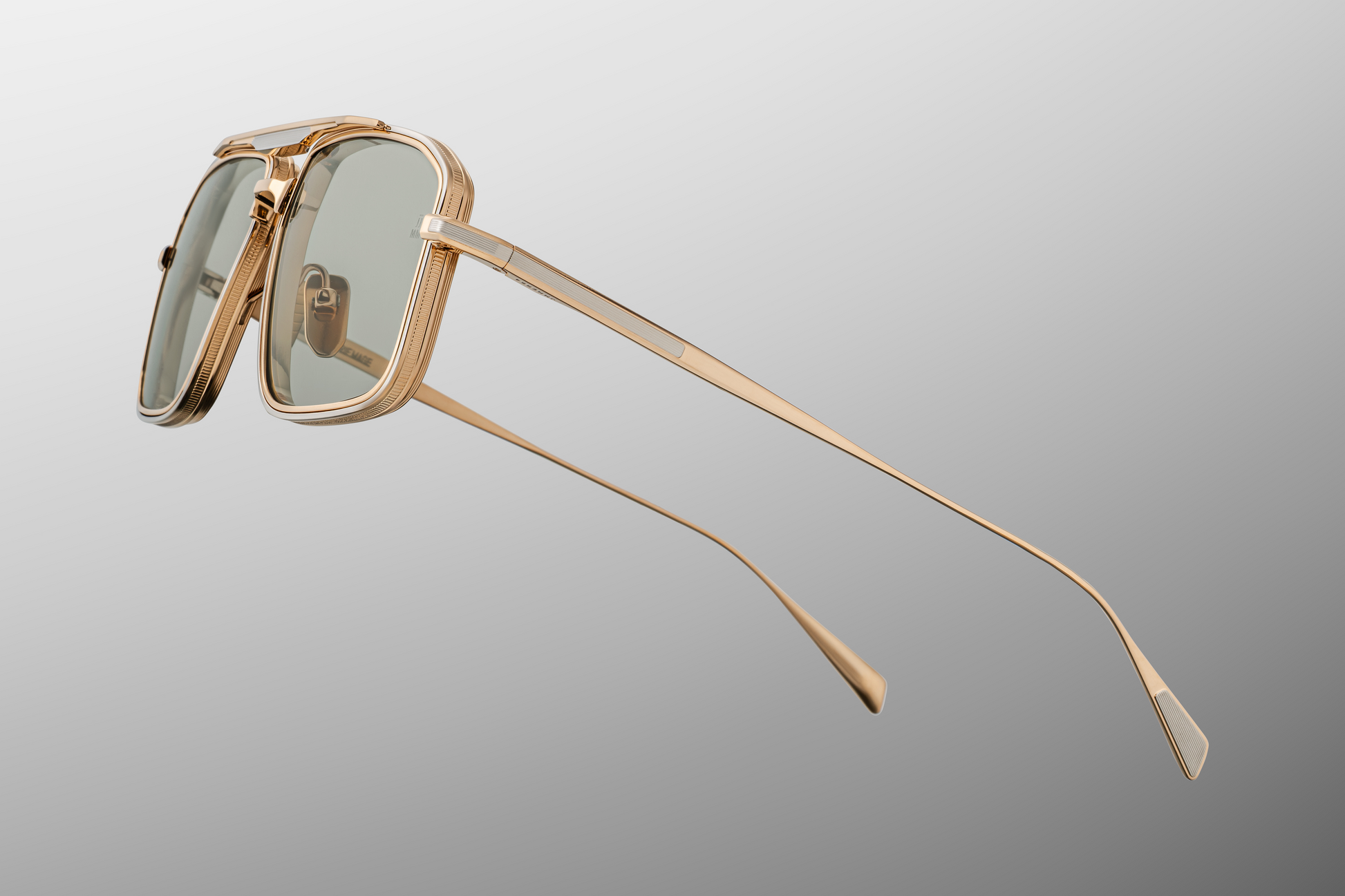 Side view of Jacques Marie Mage Earl Altan sunglasses: silver hairline-engraved titanium temples with wing tips, hidden tension-secured hinge, and custom logo nose pads. Limited edition of 500 pieces, handcrafted in Japan