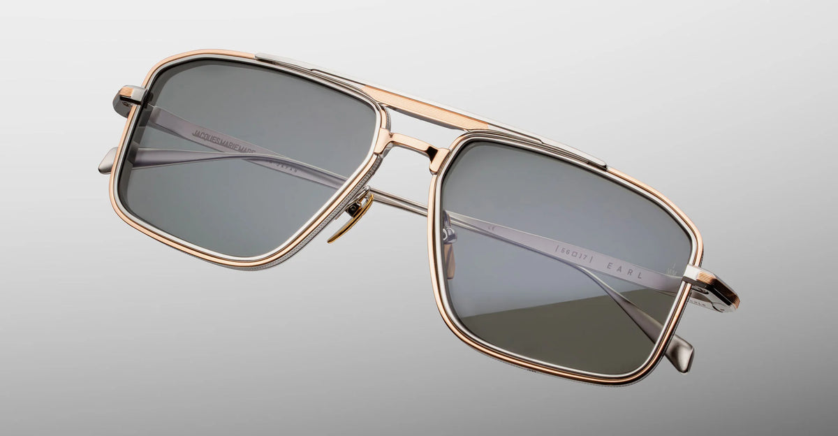 Close-up detail of Jacques Marie Mage Earl sunglasses, showing the custom nose pads with the engraved JMM logo and tension-secured hidden hinge construction.
