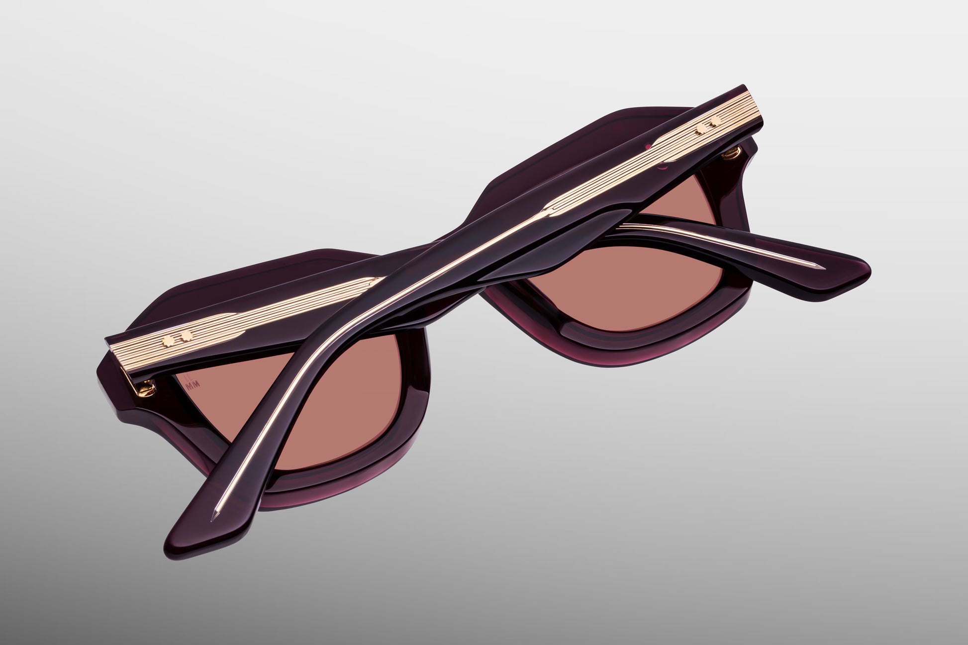 Close-up back view of Jacques Marie Mage Eichler Amarena sunglasses showing inner temple engraving and exposed wirecore structure
Rear detail of JMM Eichler Amarena frame revealing handcrafted acetate interior and limited edition markings