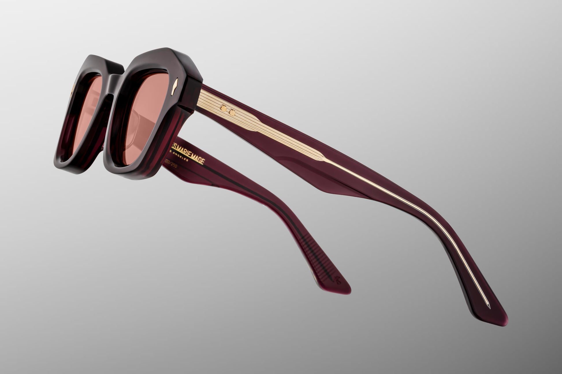 Close-up side detail of Jacques Marie Mage Eichler Amarena showing engraved wirecore, ball hinge construction and slim sculpted temples
Macro side view of JMM Eichler Amarena highlighting premium hardware and precision acetate layering