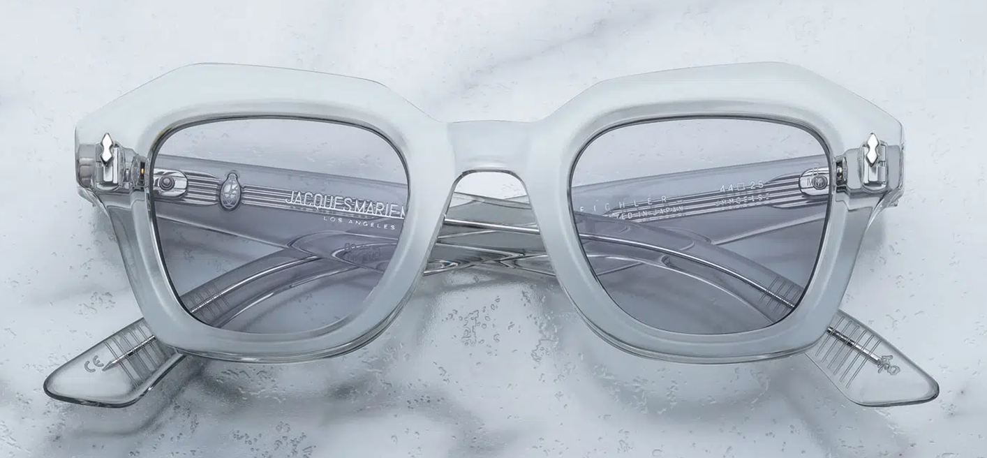 Front of the JMM Eichler in Sulfur – translucent pale yellow‑crystal acetate frame with bold geometric square lenses and silver arrowhead front pins