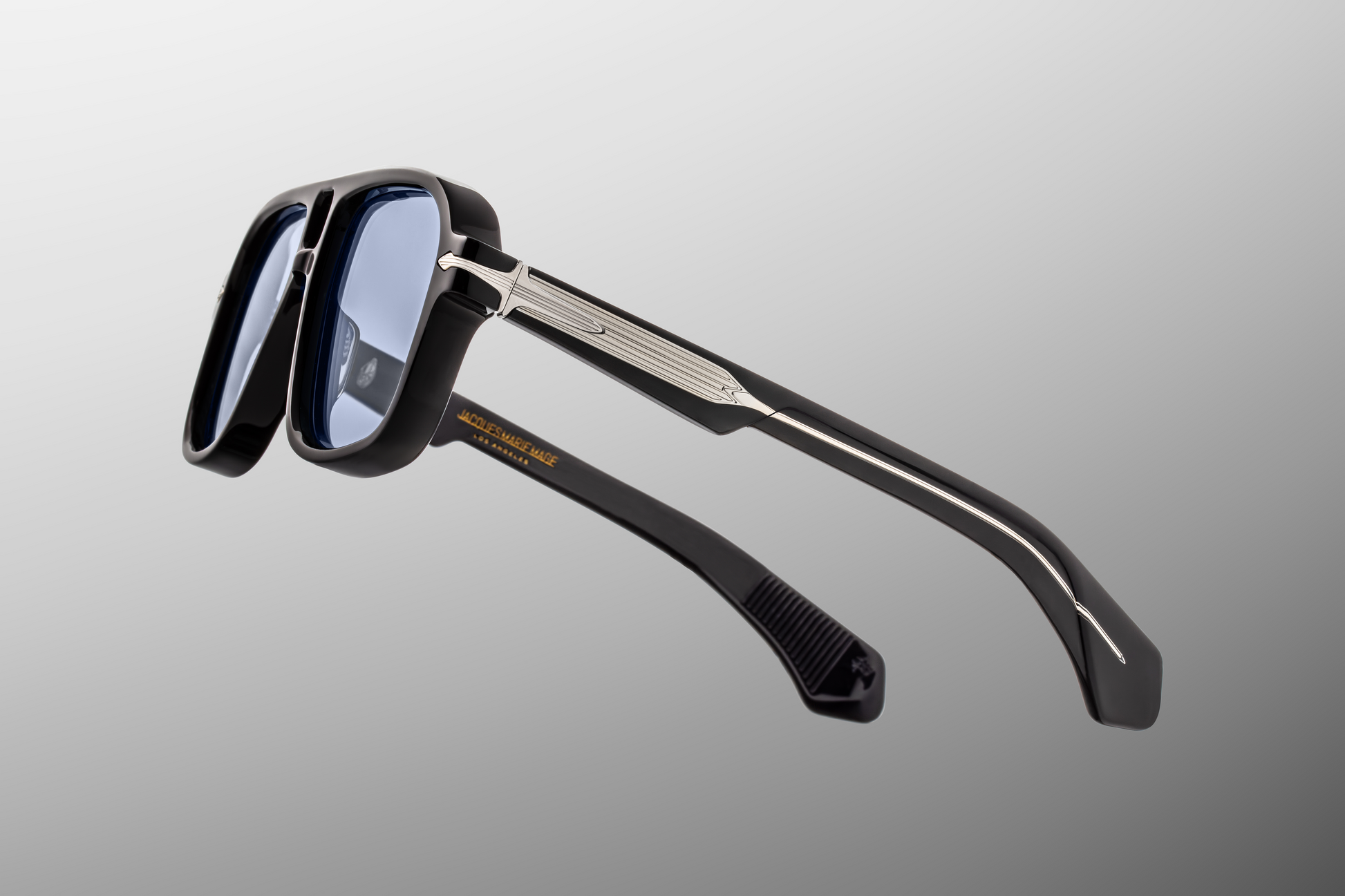 Temple detail of Jacques Marie Mage Elkhart Obscure sunglasses with signature arrowhead pin and engraved wirecore – available at WINK Optometrists.