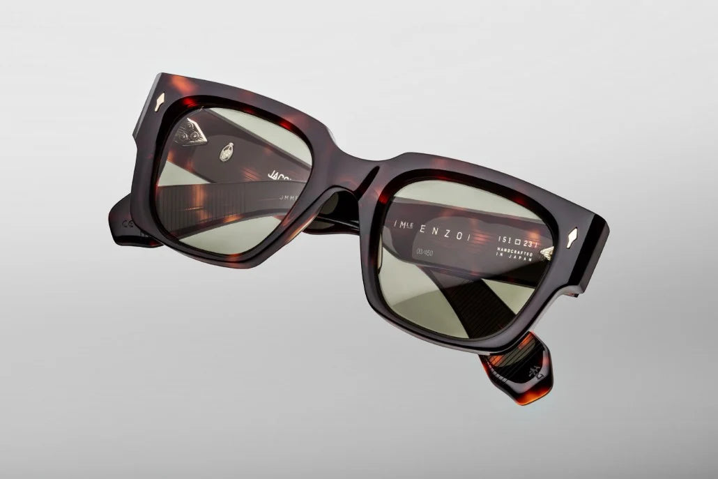 Top-down view of the JMM Enzo Tenace sunglasses, revealing the frame's bold angular geometry, the heavy 10mm thick acetate brow line, and custom tension-secured 7-barrel hinges.