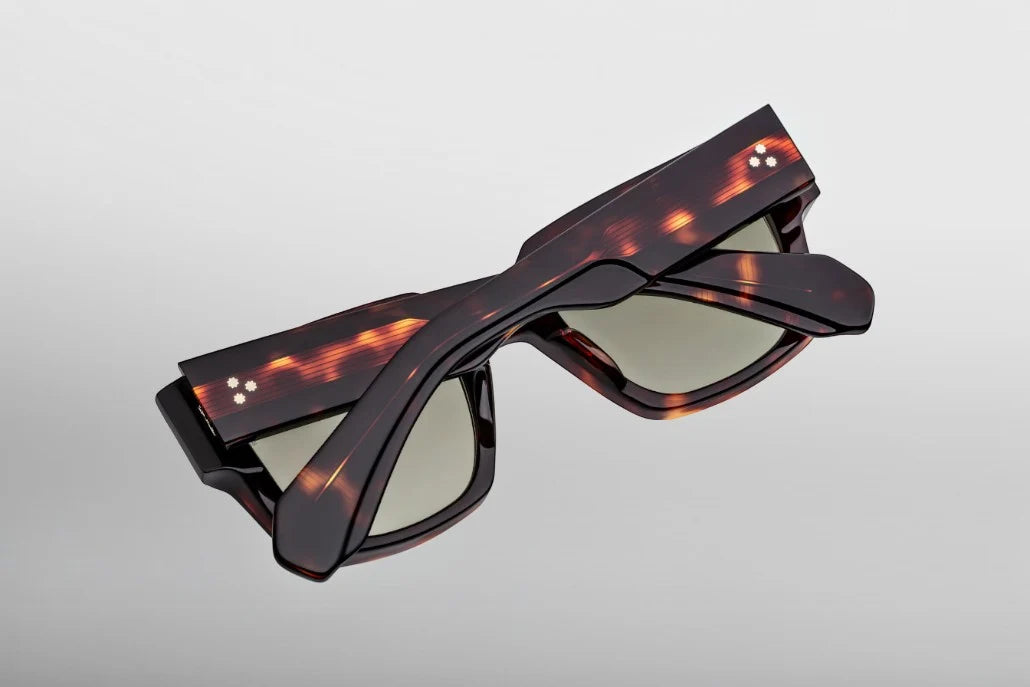 Rear perspective of the JMM Enzo Tenace temples, detailing the curved ear bends where the rich Havana tortoise shell exterior transitions to a translucent inner laminate around the silver wirecore tip.