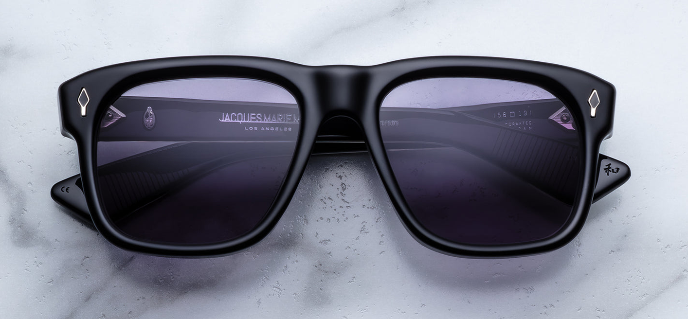 Jacques Marie Mage Epoxy II Yves Fumée — Wellington-style frame in polished black acetate with hand-painted black epoxy arrowhead front pins and Nimbus grey lenses.