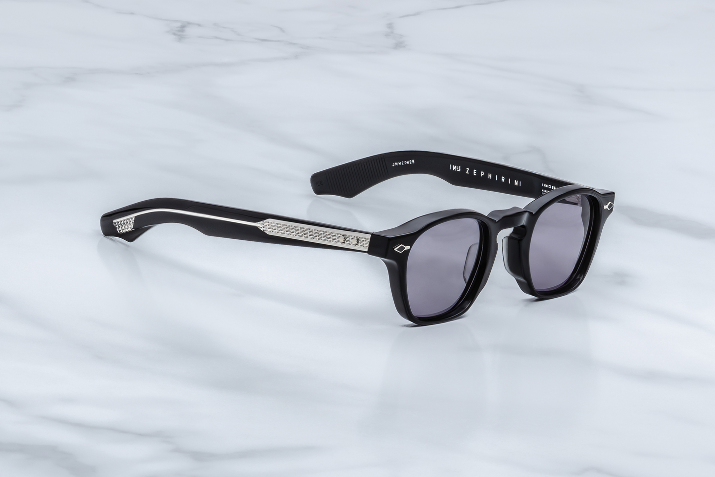 Profile of Epoxy II Zephirin Fumée — double-laminated temples with clear outer acetate and black core, showcasing exposed ‘baguette’ silver wire-core and spur rivets