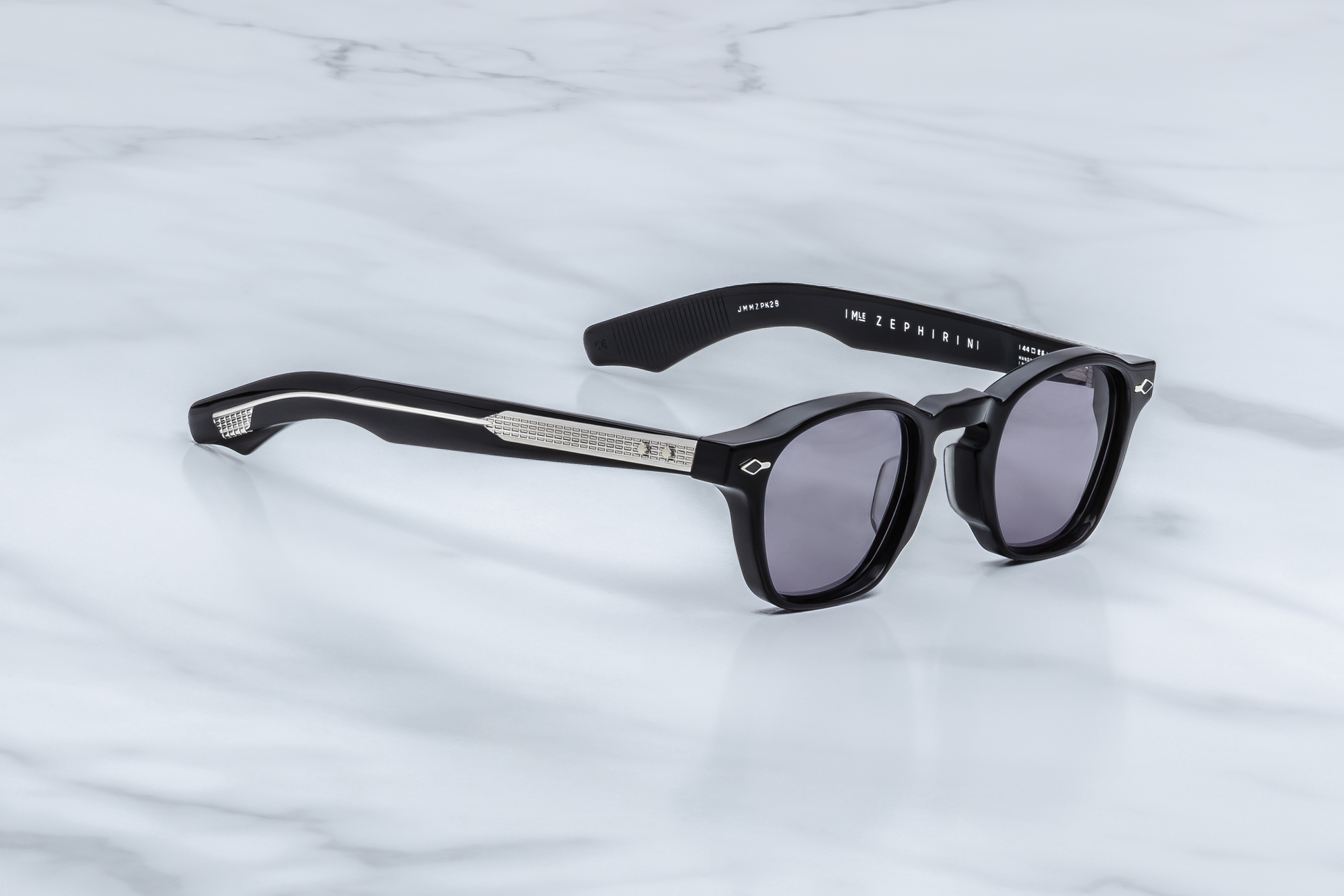 Profile of Epoxy II Zephirin Fumée — double-laminated temples with clear outer acetate and black core, showcasing exposed ‘baguette’ silver wire-core and spur rivets