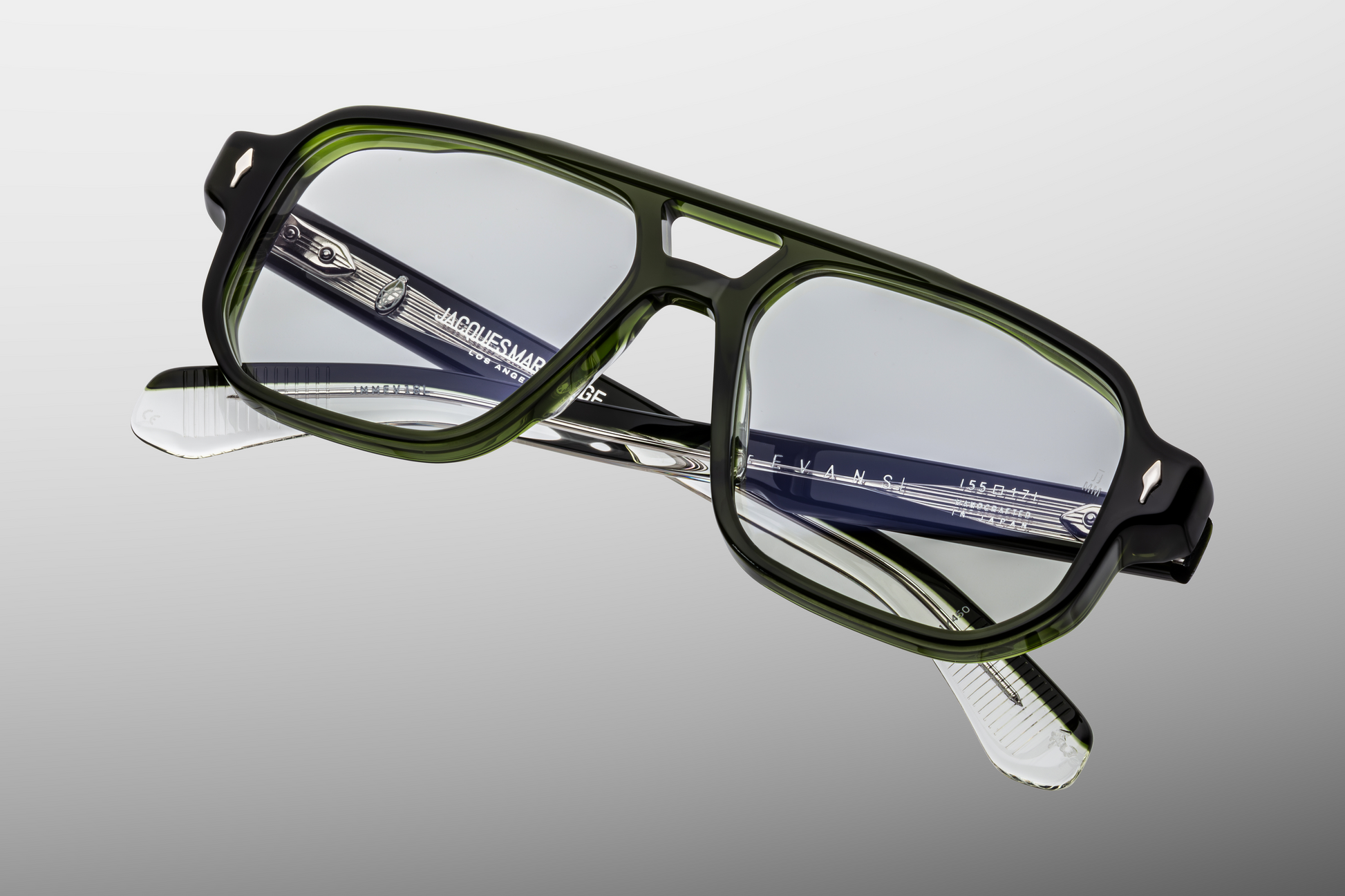 Angled view of Evans Borneo eyeglasses showcasing superlight green CR‑39 lenses with backside anti‑reflective coating, large navigator coverage and meticulous Japanese‑crafted acetate frame
