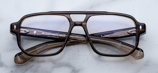 Front view of Jacques Marie Mage Evans Hazel eyeglasses featuring 8 mm tortoise‑brown acetate, ’60s‑inspired oversized navigator silhouette with double‑nose‑bridge and silver arrowhead front pins