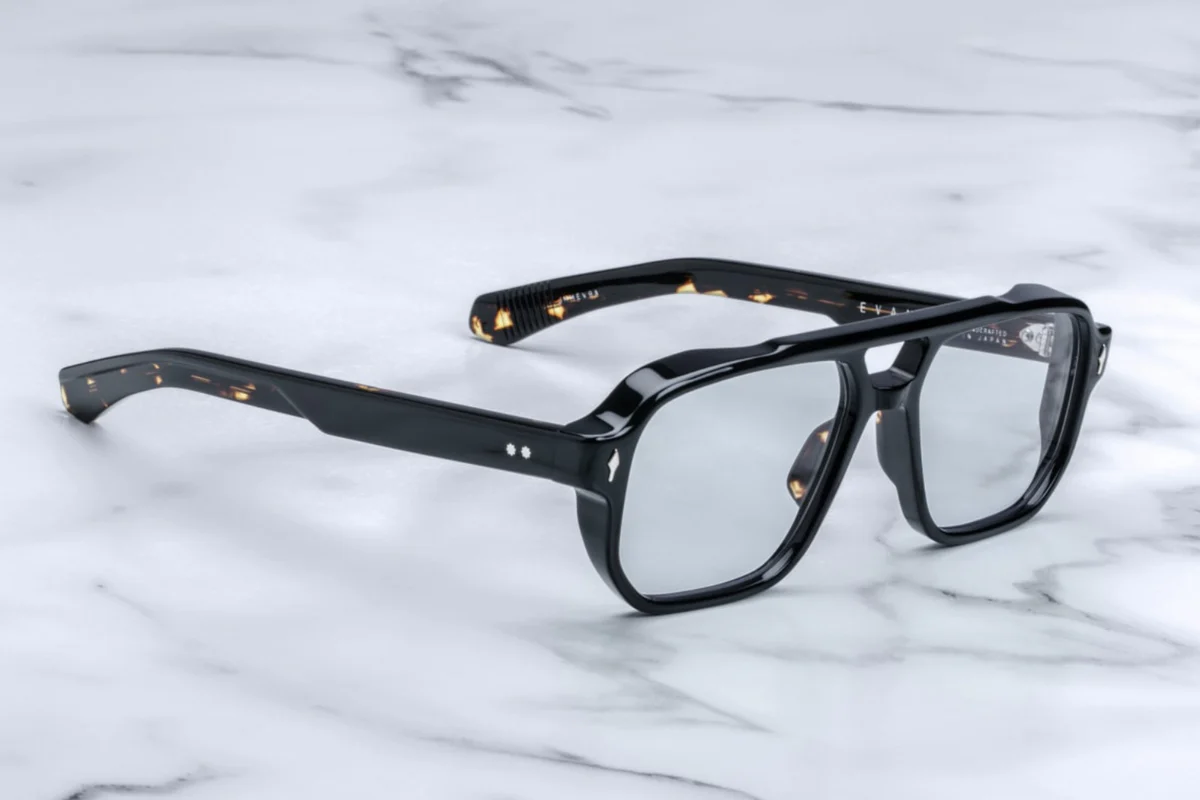 Side view of Jacques Marie Mage Evans Noir 15 optical glasses showing thick black acetate profile, distinct double-nose saddle bridge and custom double laminated acetate temples with metal accents — oversized ‘80s inspired frame