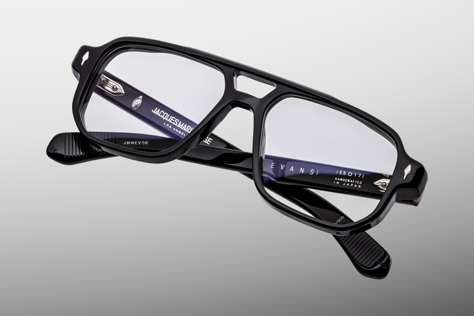 Angled view of Evans Raven highlighting black super‑light CR‑39 demo lenses with backside anti‑reflective treatment, rectangular navigator shape offering generous coverage, and flawless Japanese‑made craftsmanship