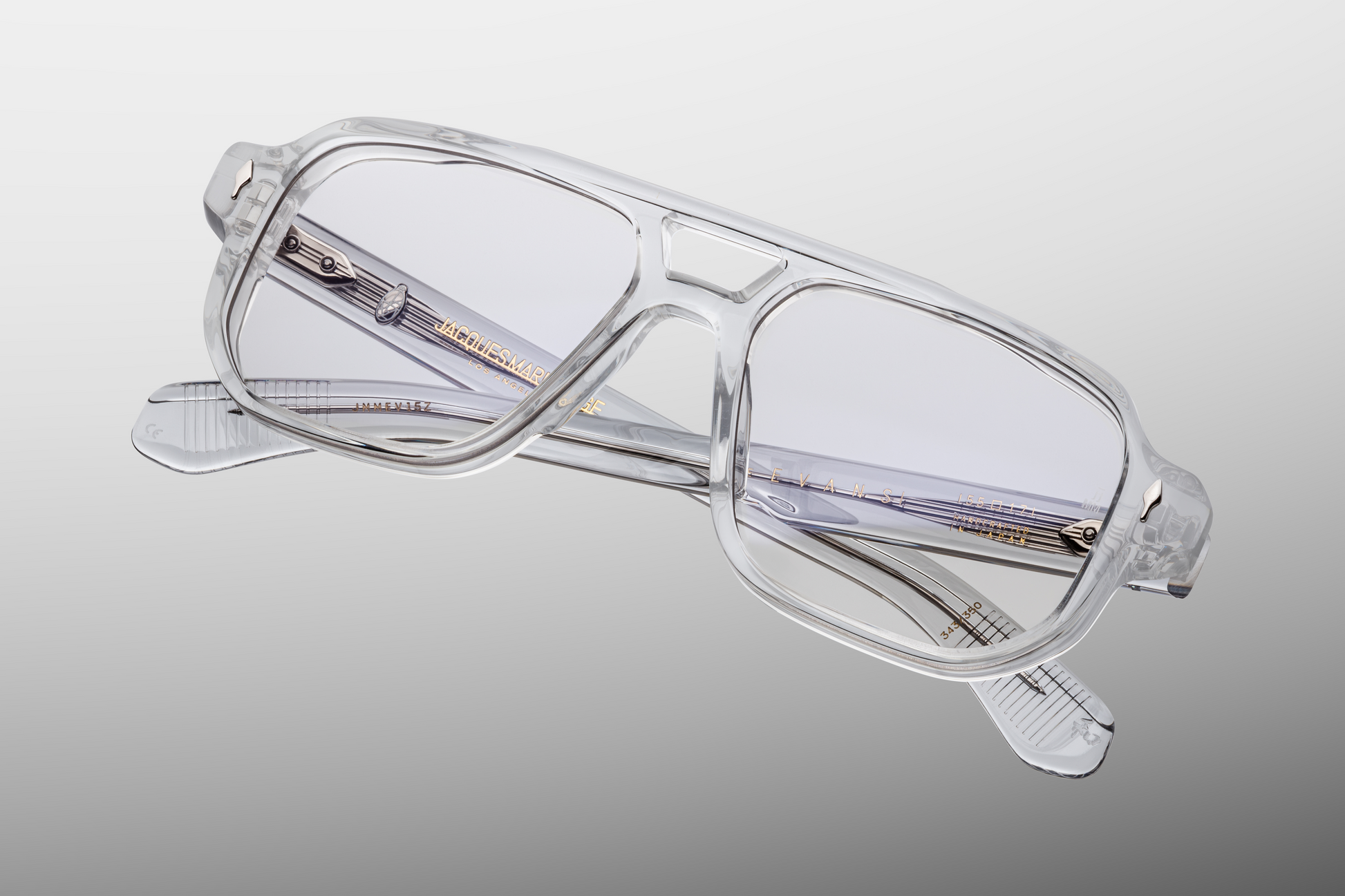 Angled view of Evans Sulfur Sunglasses highlighting superlight grey CR‑39 lenses with backside anti‑reflective coating, generous navigator frame offering broad optical coverage, and limited‑edition craftsmanship