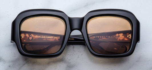Front view of JMM Marianne Faithfull ‘Monday Monday’ sunglasses: bold black acetate oversized frame with rounded square shape, thick bridge and dark sepia tinted lenses