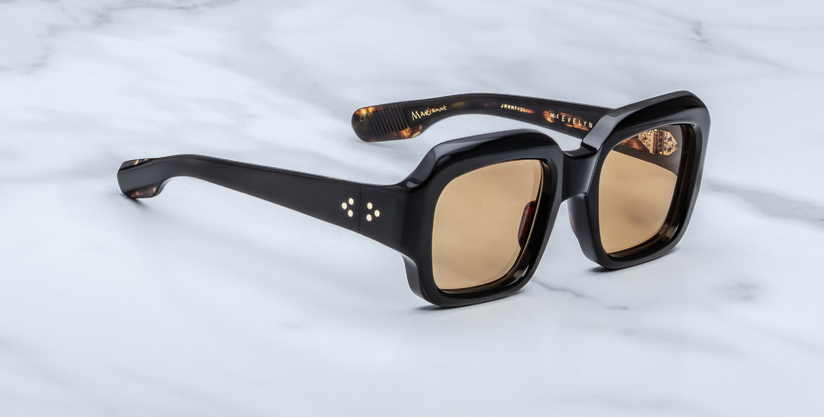 Side/temple view of ‘Monday Monday’ sunglasses: thick black acetate temples, subtle 18k gold detailing near hinge, tapering curves toward earpiece