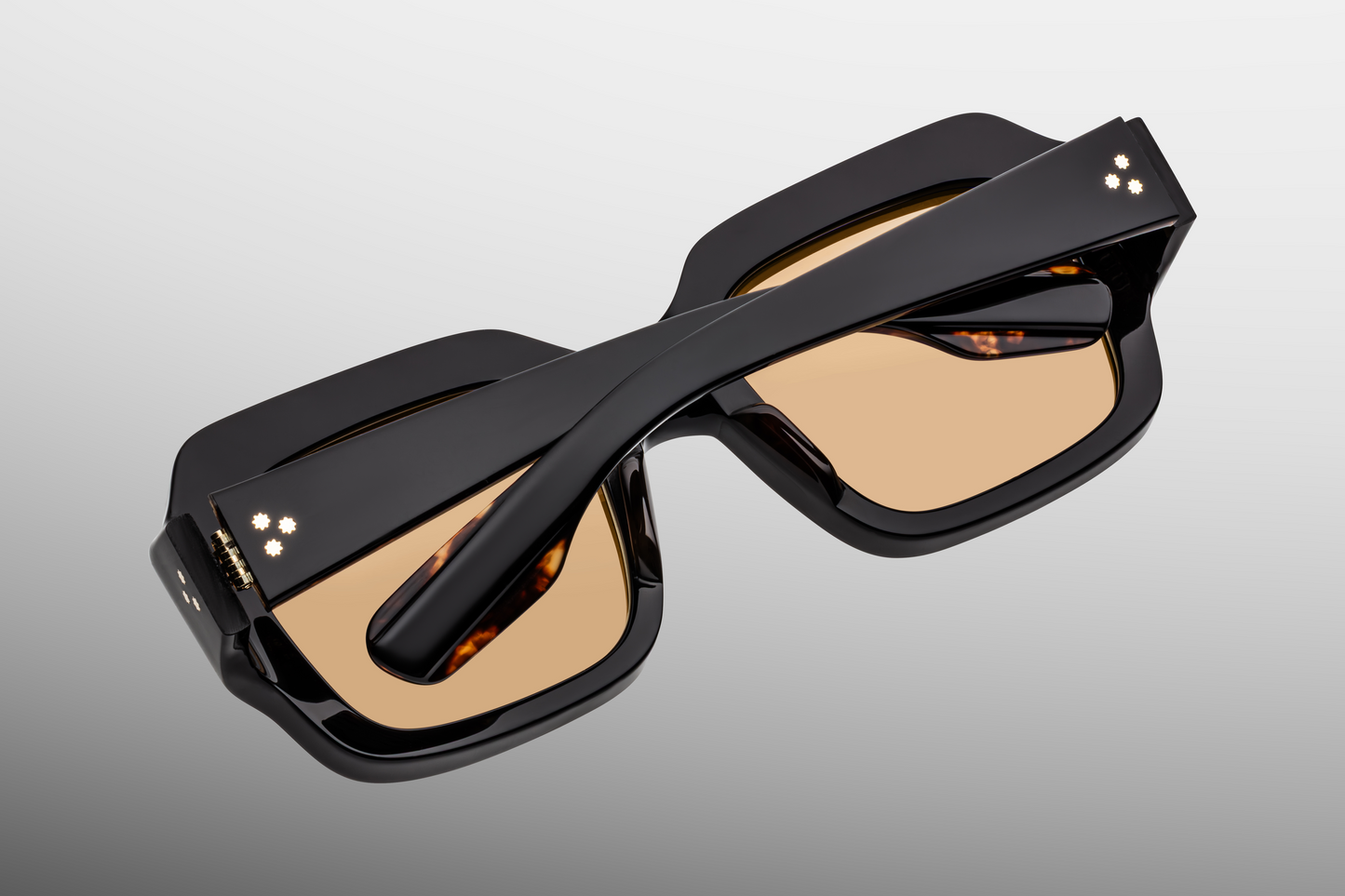 Rear/interior view of ‘Monday Monday’ sunglasses: inner side showing polished acetate, visible hinge structure, inside temple markings and clean finish