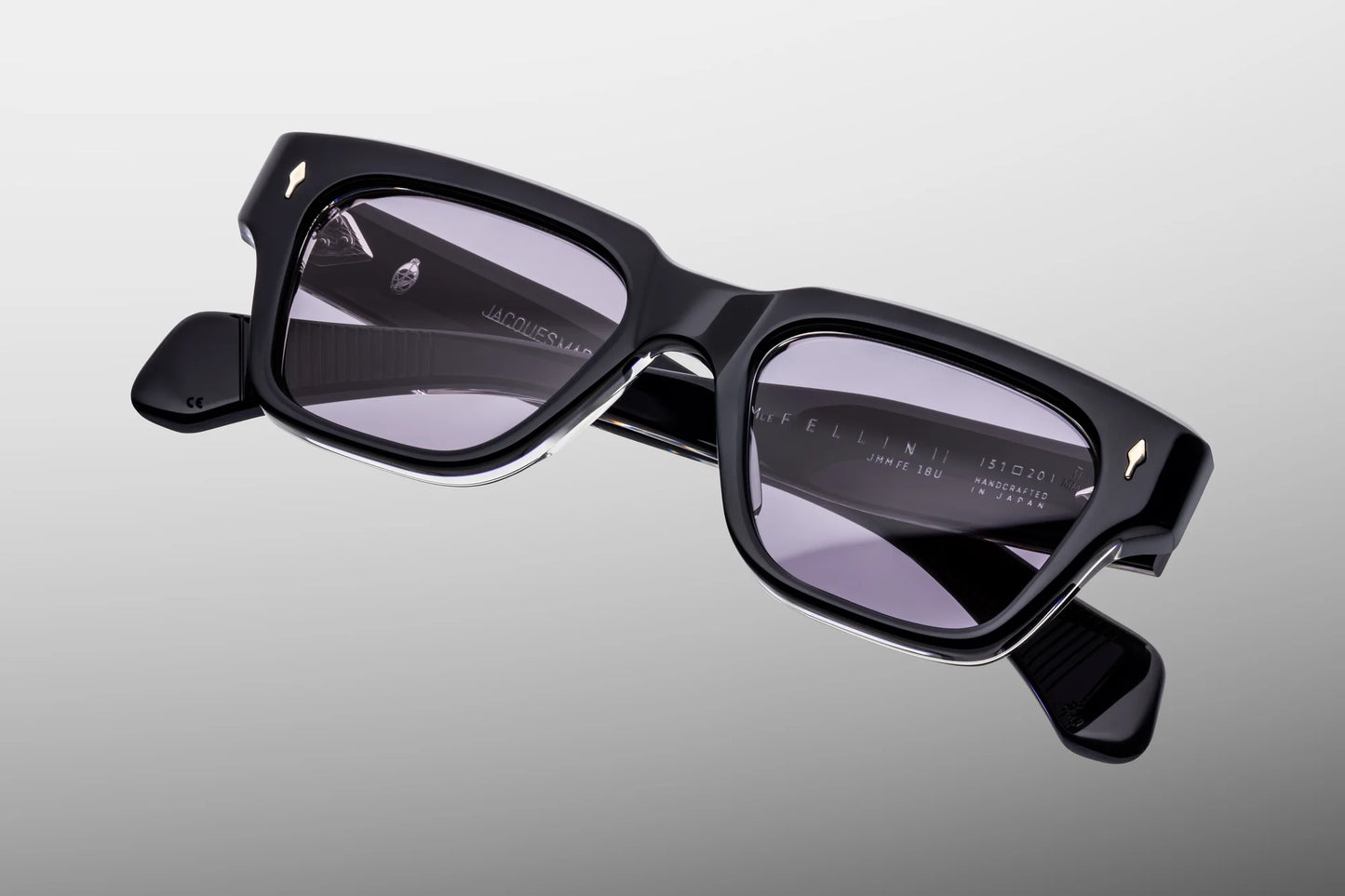 Close-up front view of Jacques Marie Mage Fellini Hudson sunglasses featuring a bold rectangular silhouette, premium blue acetate and wine gradient CR39 lenses