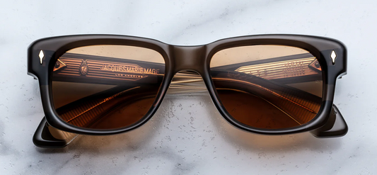 Jacques Marie Mage Jeff Goldblum Fly London sunglasses front view, rounded rectangular acetate frame in brown with sculpted brow and tinted lenses
Front view of JMM Fly London sunglasses, vintage-inspired D-frame acetate with bold bevelled brow and warm brown tones