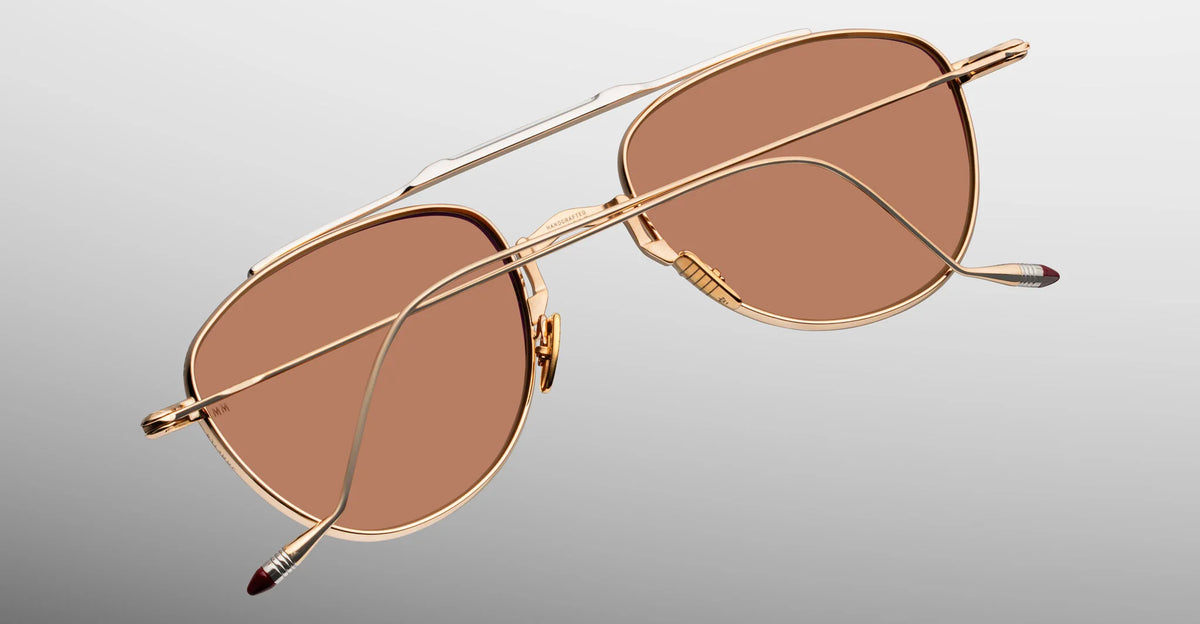  Inner rear view of Jacques Marie Mage Flynn Darjeeling sunglasses, detailing the precision-engineered block hinge and the limited-production batch number foil-stamped neatly on the interior surface of the sleek titanium arm.