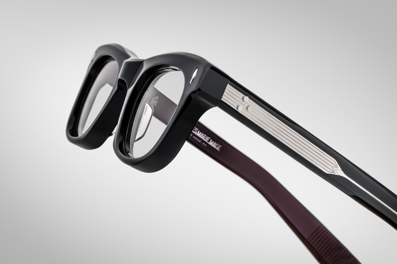 Side view of Jacques Marie Mage Godard bloodstone frames, highlighting thick acetate temples and signature metal arrowhead detail