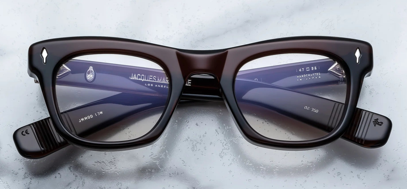 Front of Jacques Marie Mage Godard in Zoltar — rich brown cured acetate with a pronounced brow-line, squared lenses, and sterling silver arrowhead front pin.