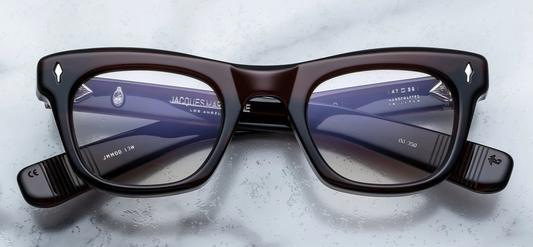 Front of Jacques Marie Mage Godard in Zoltar — rich brown cured acetate with a pronounced brow-line, squared lenses, and sterling silver arrowhead front pin.