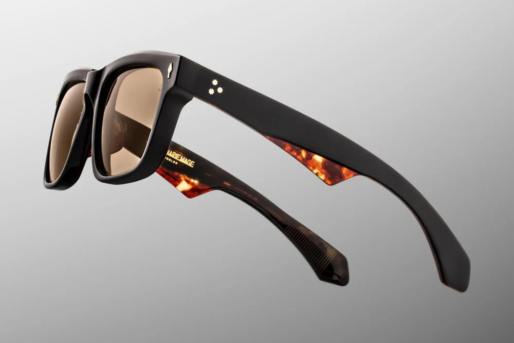 Side profile of Jacques Marie Mage Hyannis Noir 15 sunglasses, highlighting the thick 10mm acetate temples, custom 7-barrel hinges, and gold core wire detailing.