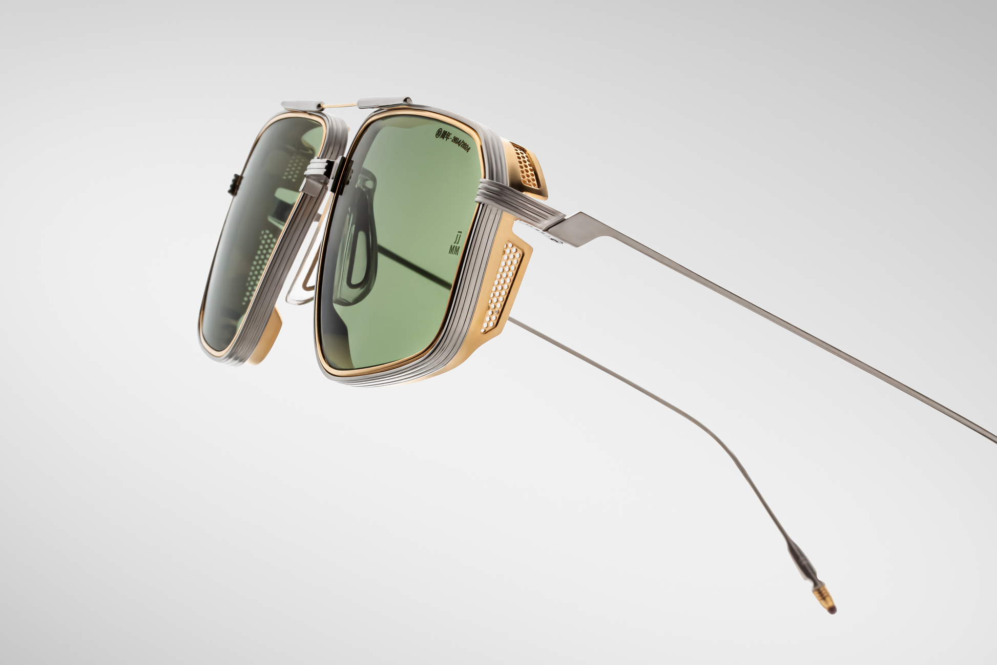 Side view of Jacques Marie Mage Jagger glasses in Electrum, showing the sculpted gold metal temples with finely engraved detailing and perforated metal side shields that add both style and sun protection.
