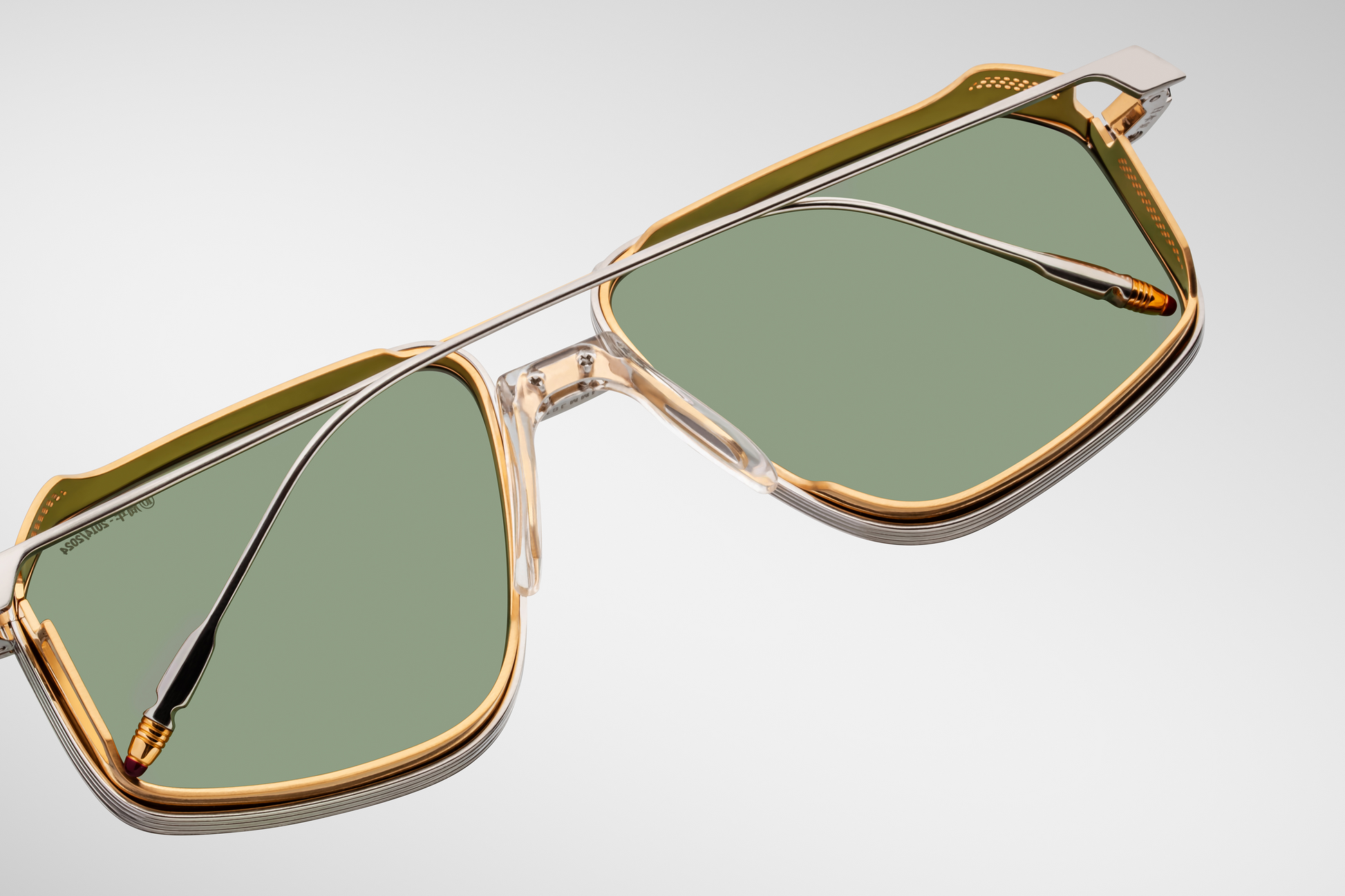 Back view of Jacques Marie Mage Jagger glasses in Electrum, highlighting the curved temples, inner hinge construction, and the elegant form of the perforated side shields
