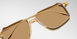 Detail shot of the lenses on the Jacques Marie Mage Hagger Roma sunglasses, emphasizing the high-quality tinted lenses and polished acetate frame edges