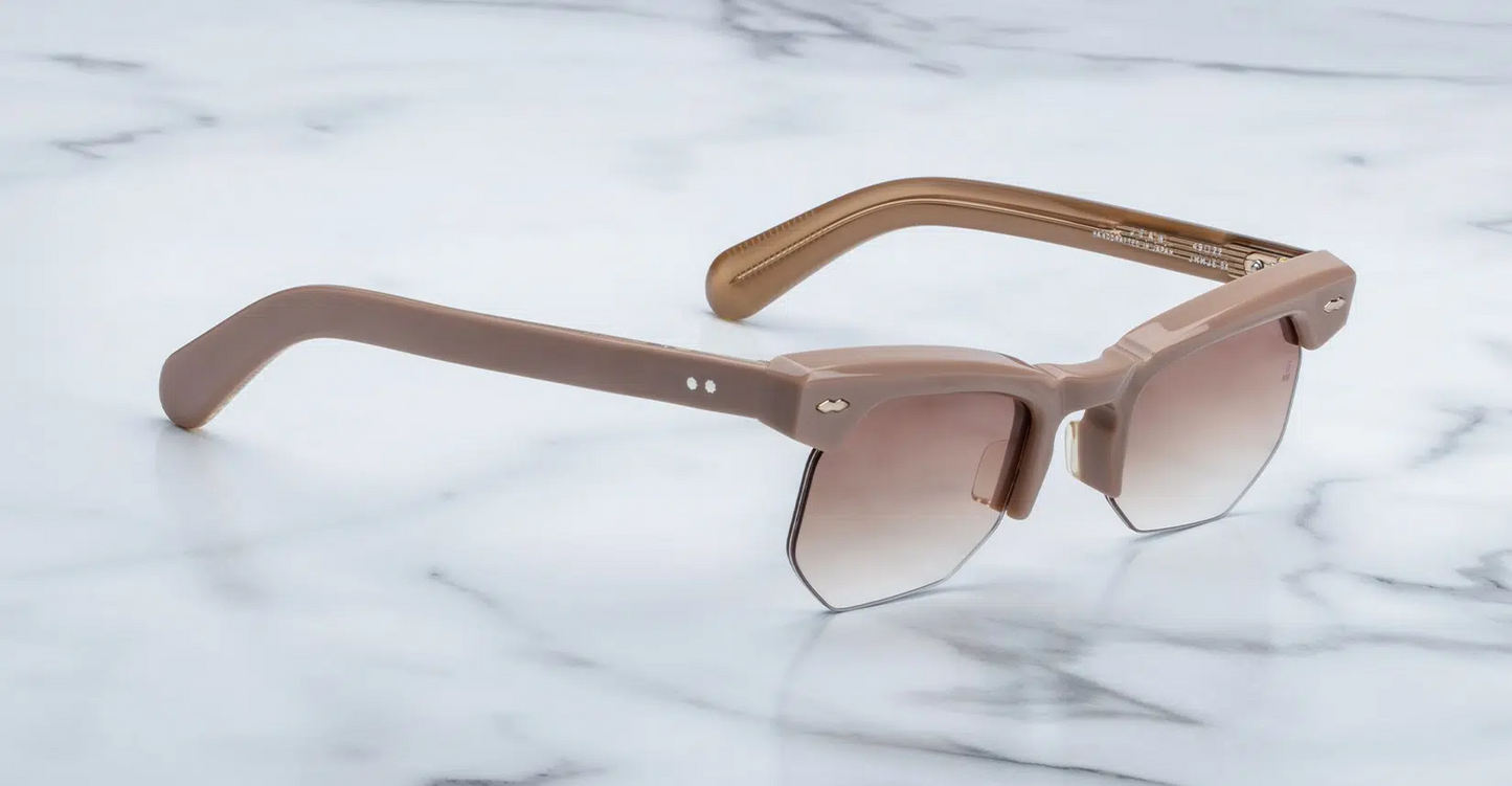Side profile of Jacques Marie Mage Jean sunglasses in Porter, highlighting the custom double-laminated cellulose acetate temples. The temples feature a tension-secured custom ball hinge, emphasizing the frame's luxurious craftsmanship