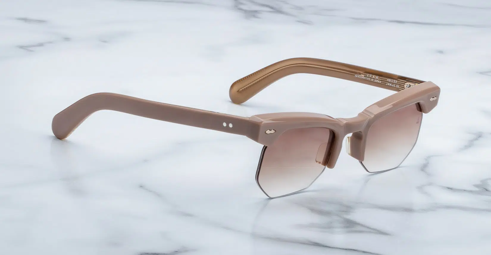 Side profile of Jacques Marie Mage Jean sunglasses in Porter, highlighting the custom double-laminated cellulose acetate temples. The temples feature a tension-secured custom ball hinge, emphasizing the frame's luxurious craftsmanship