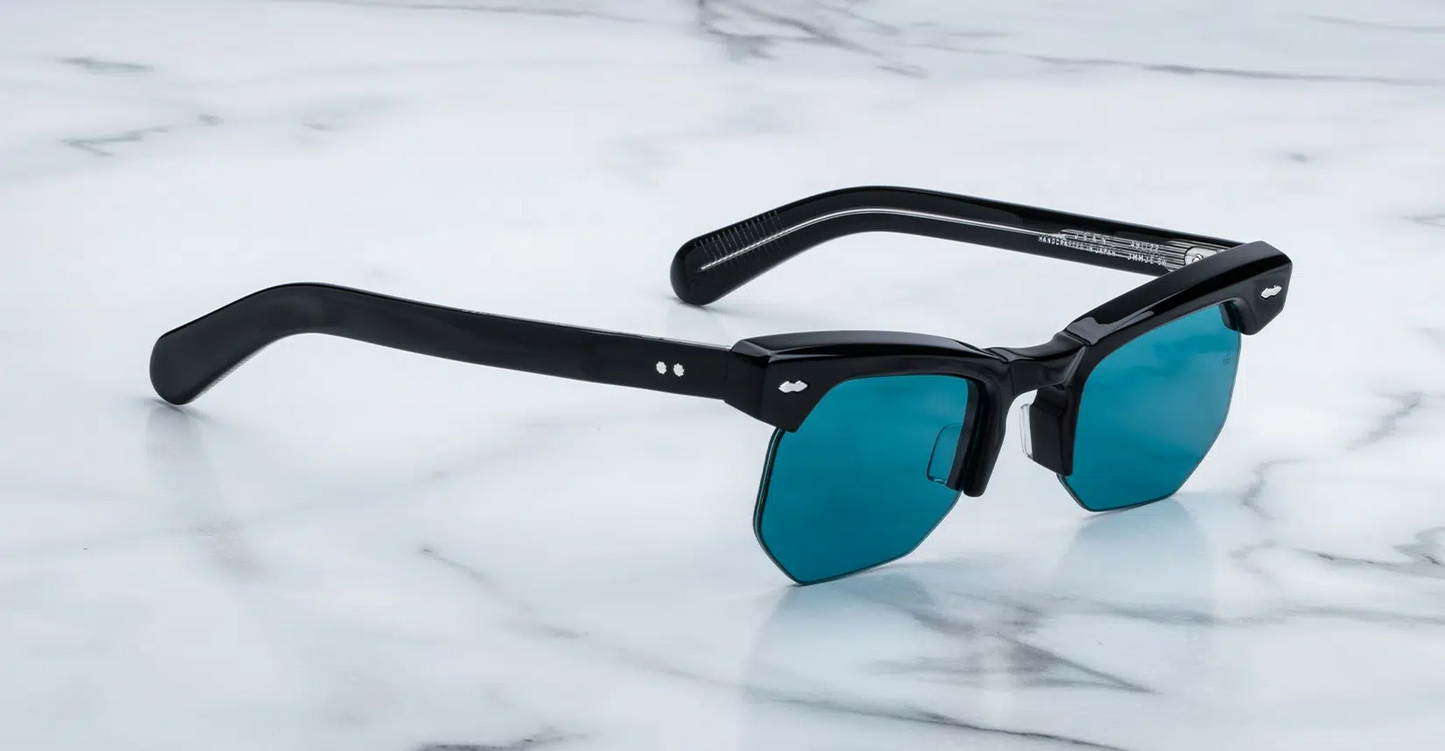 Right temple of Jean Titan — sleek grey acetate with exposed silver‑core wire, custom hinge, and tapered temple tip