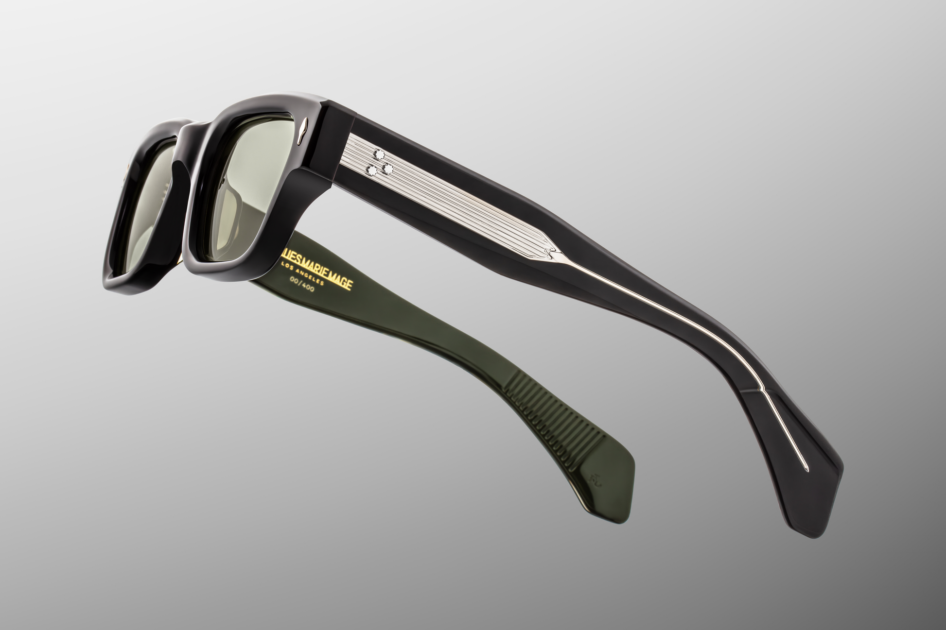 Side profile of Jacques Marie Mage Jeff Cobra sunglasses showing thick acetate temples and signature arrowhead rivets – available at WINK Optometrists.