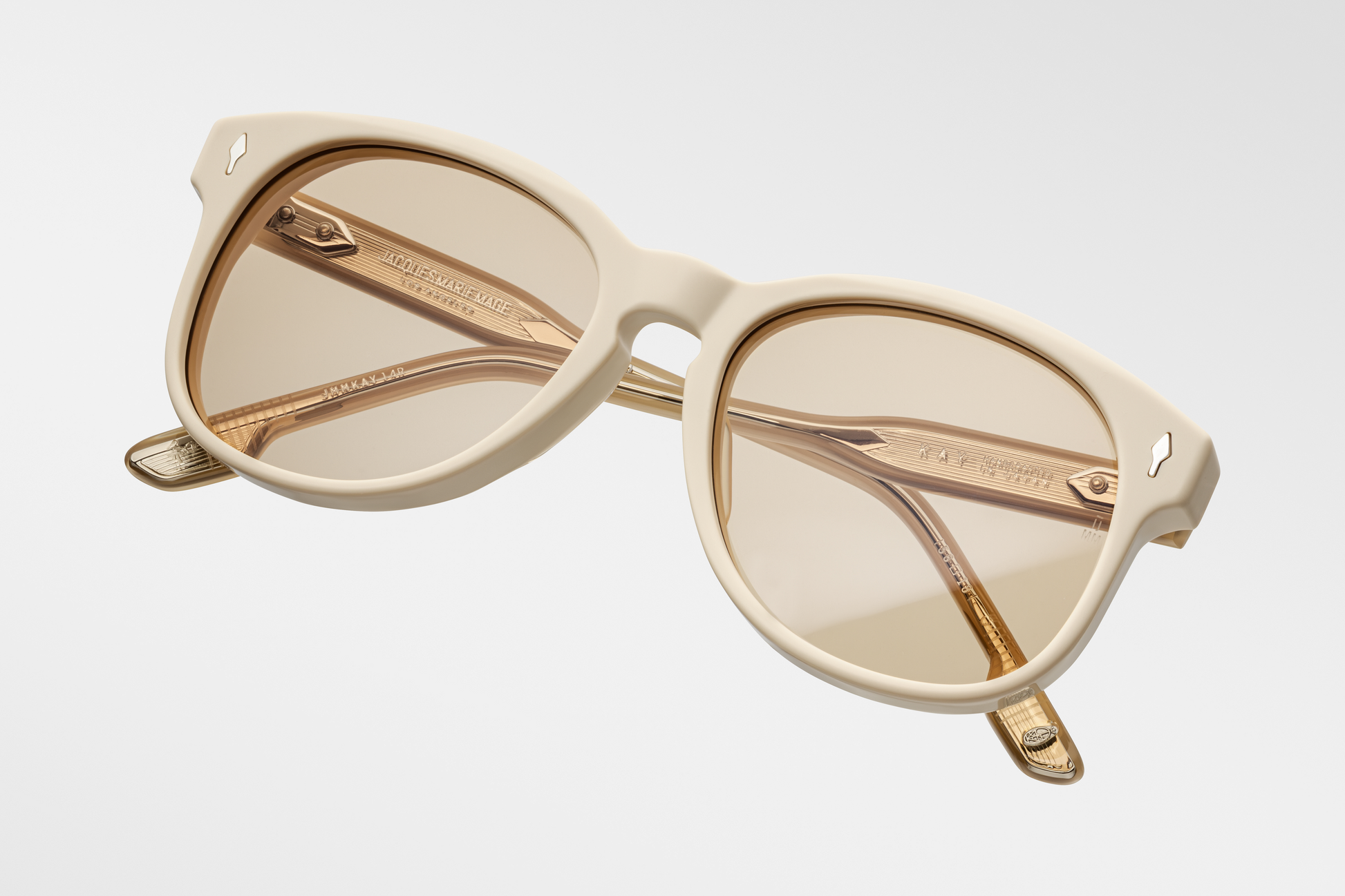 Overhead shot of the Kay Sun Suede — gently curved bridge, double-bridge structure, thick 10 mm suede acetate frame, and a smooth taper into the temples.