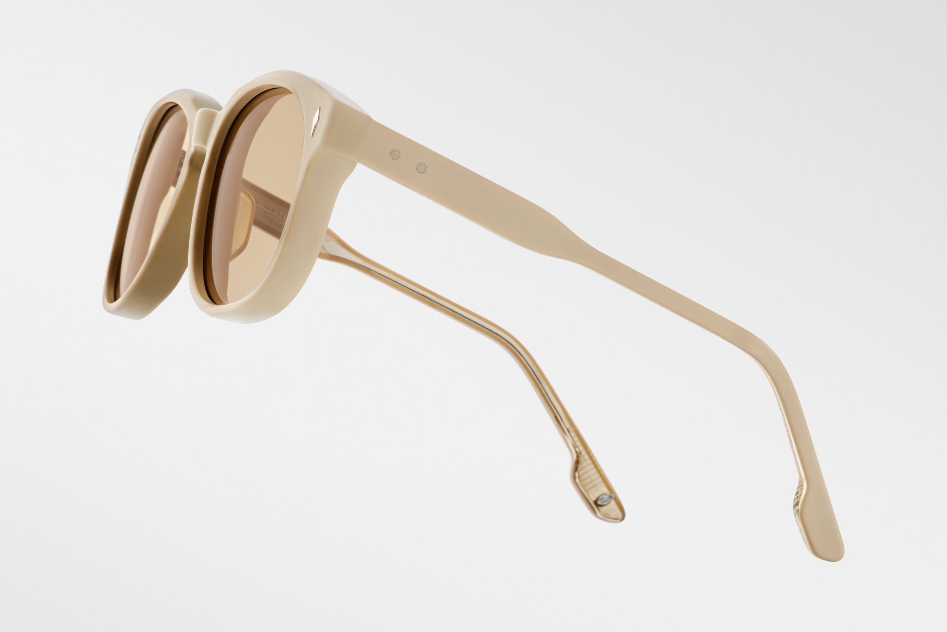 Left temple of the Kay Sun Suede — matte yellow sculpted acetate with the same exposed wire-core, arrowhead detail near the front, and a delicate hairline light-gold hinge