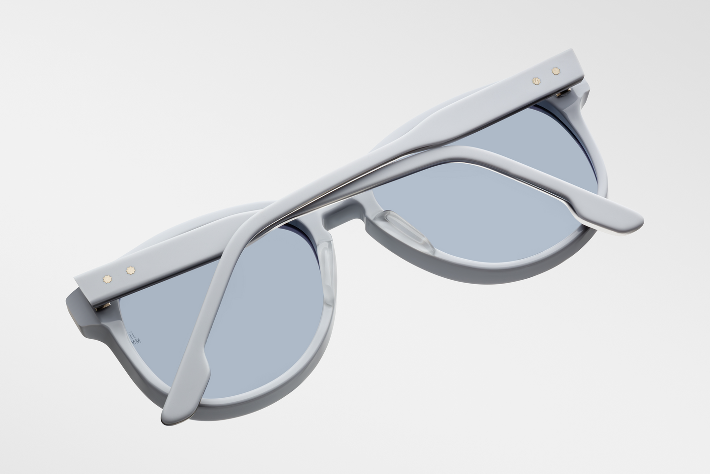 Interior/back of the Kay Sky Suede — polished inside of the pastel-blue acetate, visible wire-core inside the temples, and the craftsmanship of the frame’s finishing


