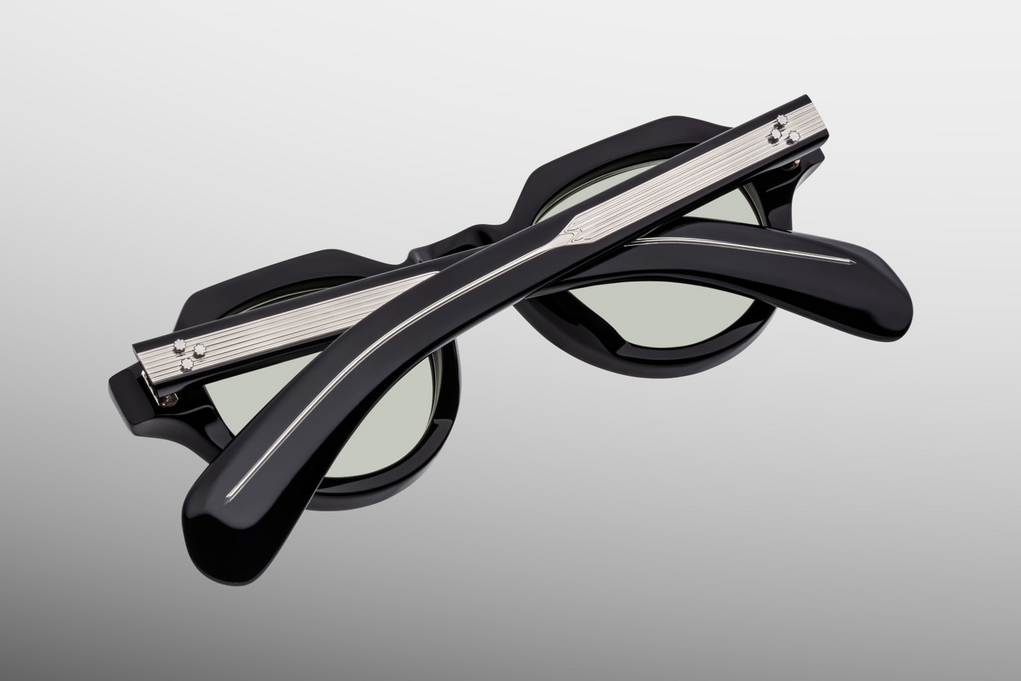 Back / interior view of the Kellerman Cobra — smooth black acetate inner frame, visible exposed wire-core, and the serial number engraved on the temple.