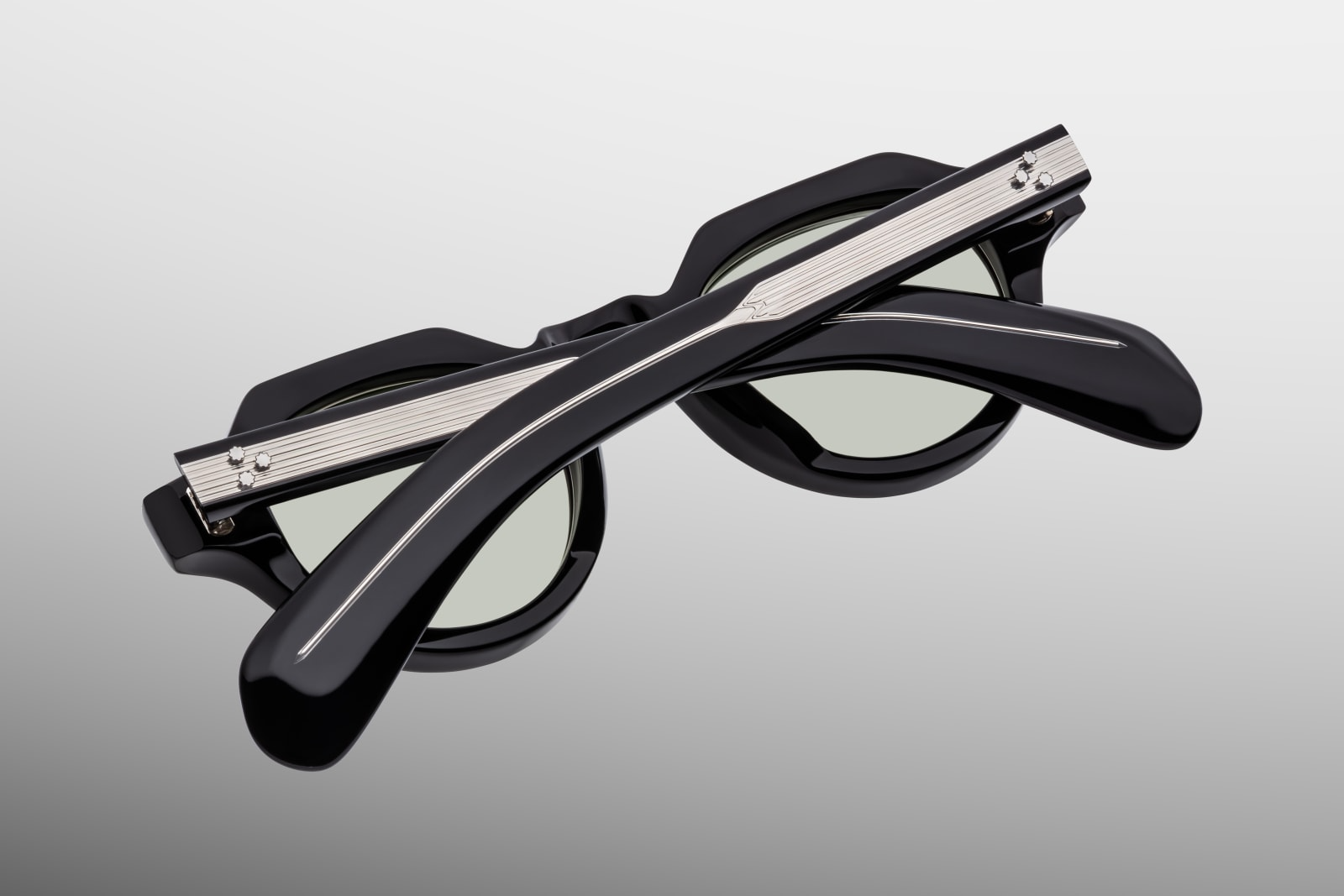 Back / interior view of the Kellerman Cobra — smooth black acetate inner frame, visible exposed wire-core, and the serial number engraved on the temple.