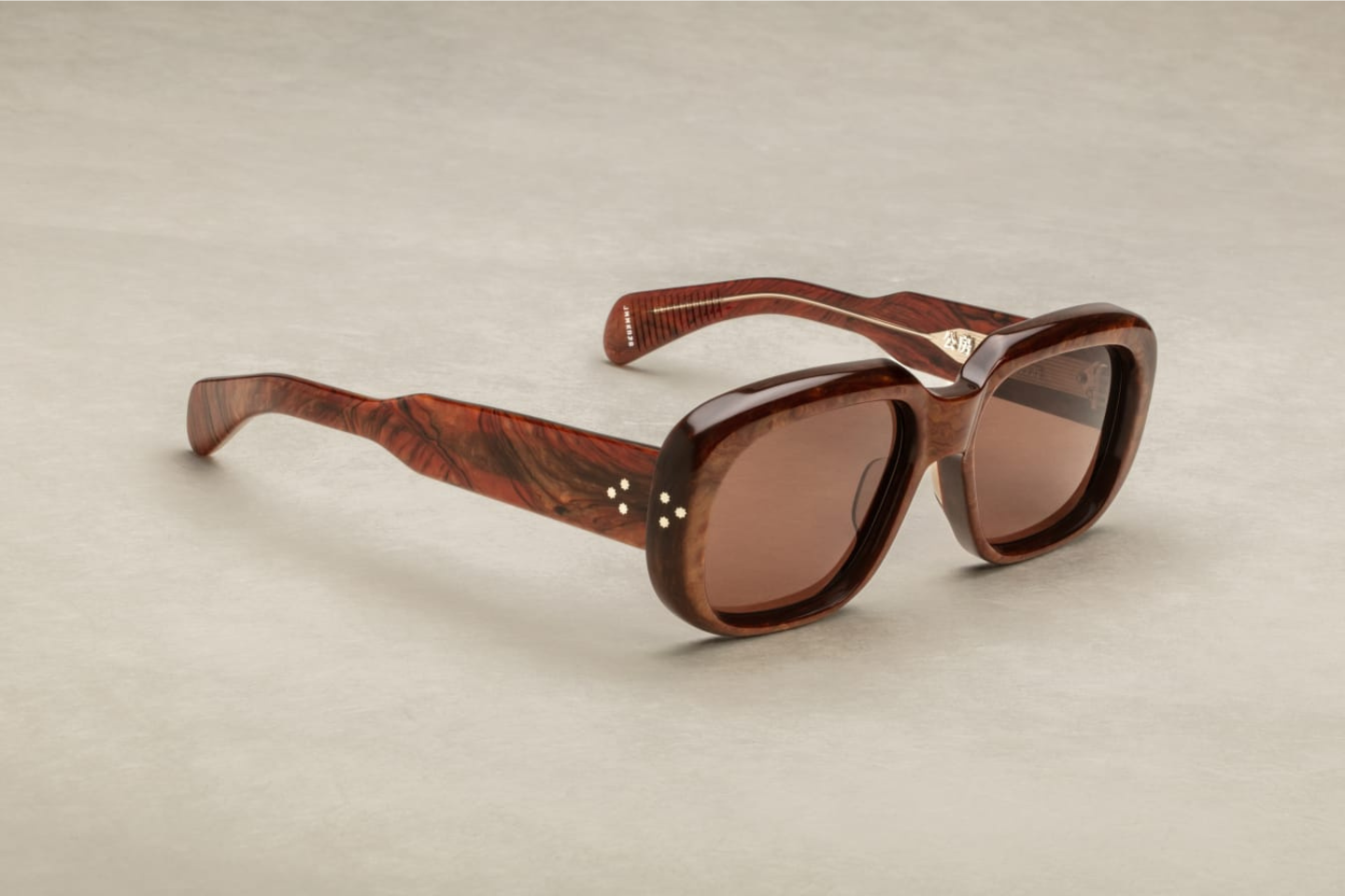 Side profile of Kobo Burlwood sunglasses, illustrating the Brown 10mm cured cellulose acetate frame with custom double laminated acetate temples and brown lenses
