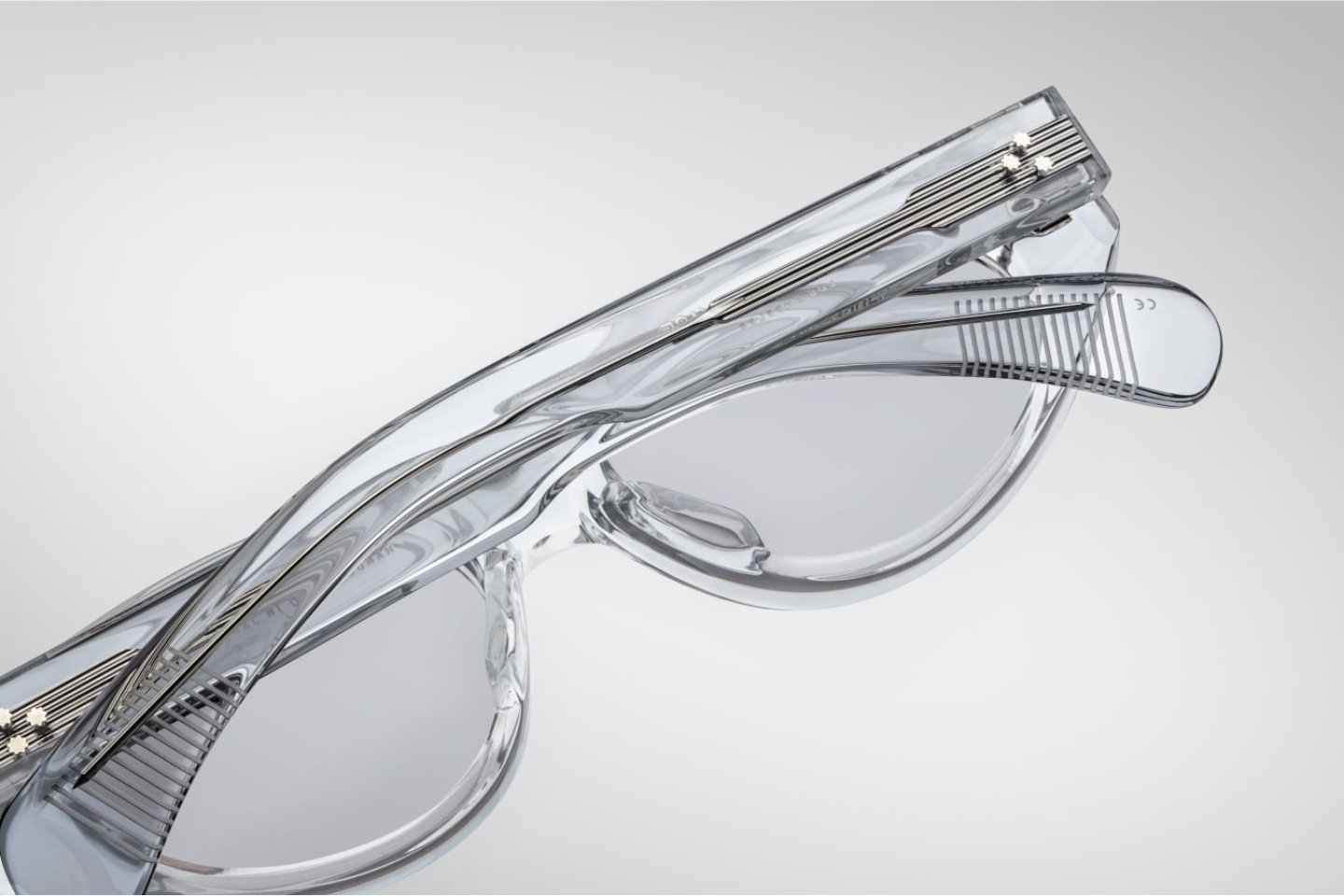 Folded Jacques Marie Mage Krasner Sulfur sunglasses with gold-embellished temples and compact designer frame craftsmanship