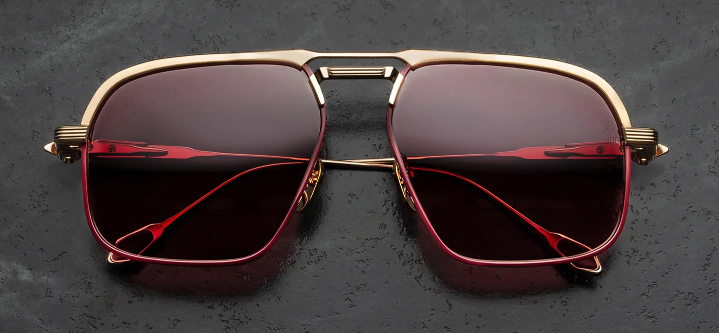 Front view of Jacques Marie Mage Labarge Champagne sunglasses. Features a large 1970s-inspired titanium navigator frame in light gold with a thick, sculptural monoblock top bar and double bridge. The eye rims are finely engraved with a Chimayo textile motif, housing mahogany gradient lenses.