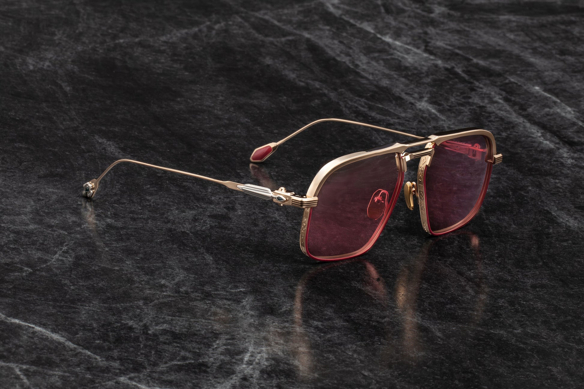  Three-quarter studio shot of Jacques Marie Mage Labarge Champagne sunglasses, showcasing the dimension of the light gold frame and mahogany gradient lenses. The angle captures the detailed hairline engravings across the top bar and the gemstone-inlaid arrowhead accent at the temple hinge.