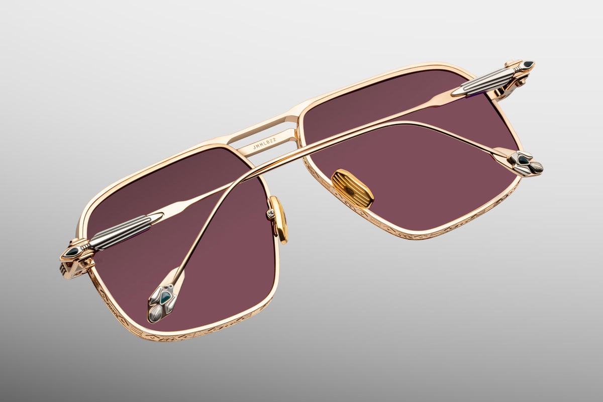 Rear view looking inside the Jacques Marie Mage Labarge Champagne frames. Shows the back of the mahogany gradient lenses, classic gold titanium nose pads engraved with the JMM logo, and the interior precision construction of the custom monoblock hinges.