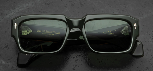 Front view of Jacques Marie Mage Dakota Viper sunglasses. Features an impressive 10mm thick, polished dark green acetate frame with a bold rectangular silhouette and aggressive bevel cuts. Signature sterling silver arrowhead pins accent the upper temples, framing solid green Tarragon mineral glass lenses