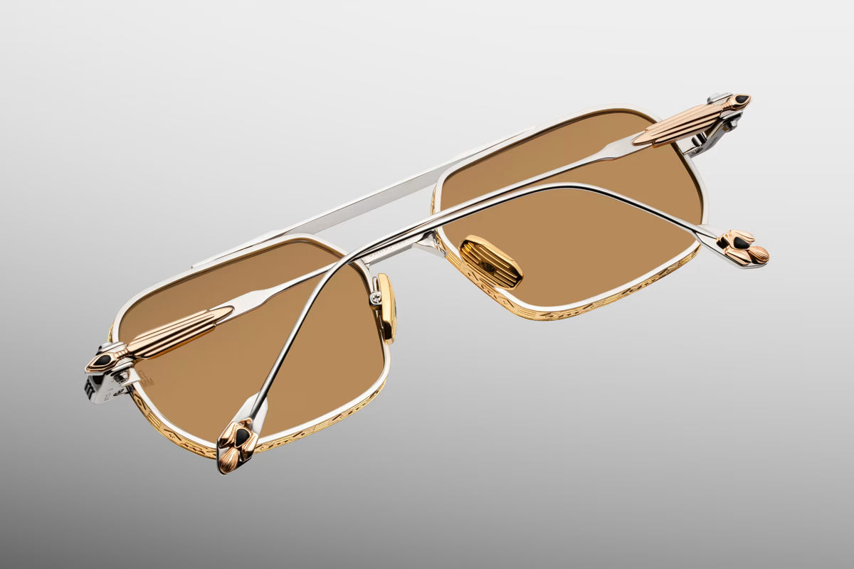 Rear view looking inside the Jacques Marie Mage Deaver Electrum frames. Shows the back of the light yellow dandelion mineral lenses, sleek titanium nose pads, and the technical, tension-fixed interior design of the custom monoblock hinges