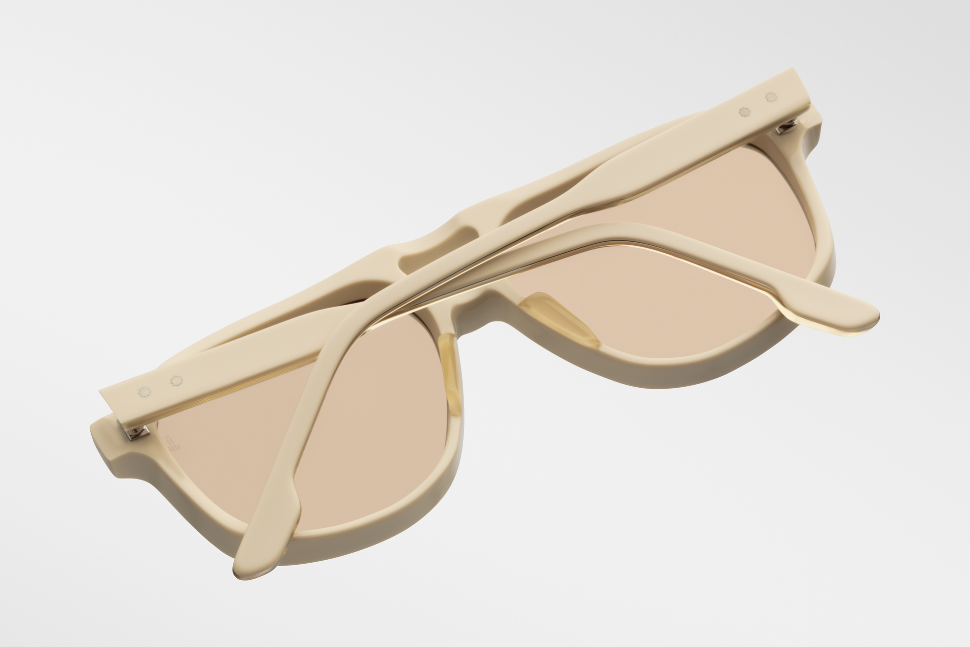 Bottom-up view of Jacques Marie Mage Leonard Suede sunglasses in Sun Suede: emphasizes the thickness of the acetate frame and the distinctive shape of the lenses. The light gold wirecore is visible along the inner edge of the temples.